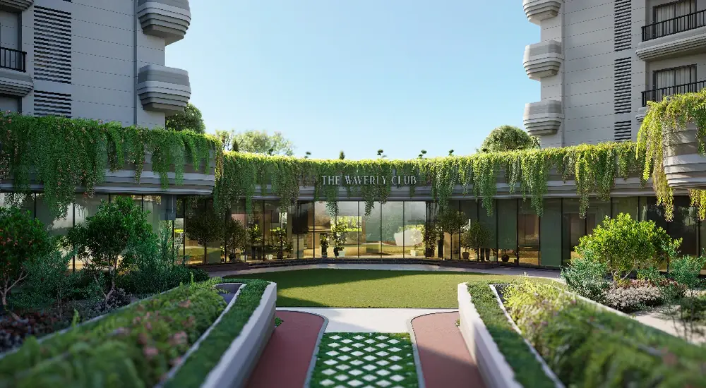 Entrance to The Waverly Club surrounded by greenery and landscaped pathways.