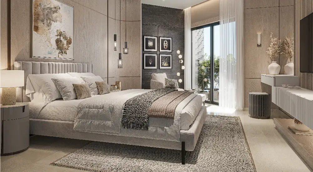 Stylish master bedroom with a large bed, artwork, and modern decor elements.