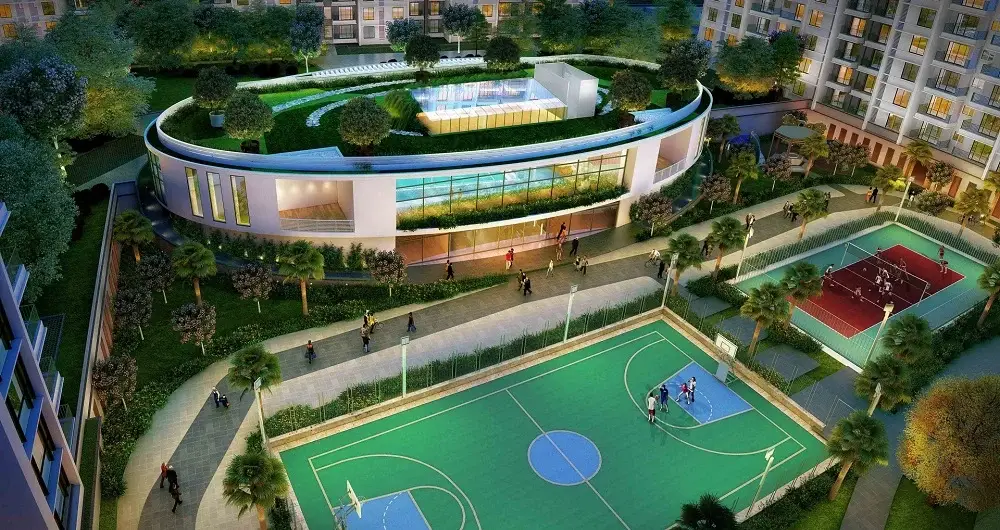 Aerial view of a sports complex featuring basketball and tennis courts surrounded by greenery.