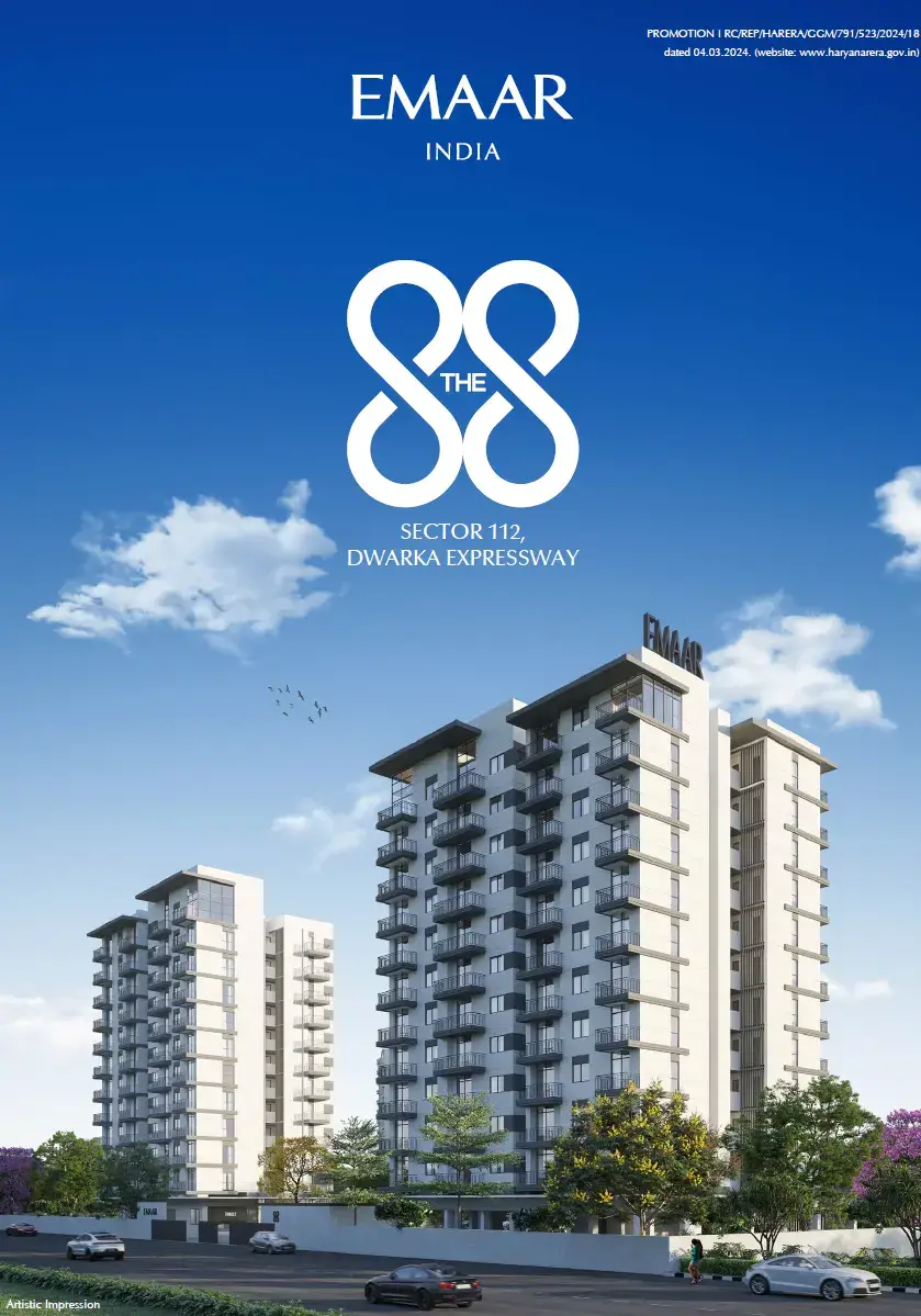 Modern residential buildings with balconies, greenery, and a clear blue sky in the background.