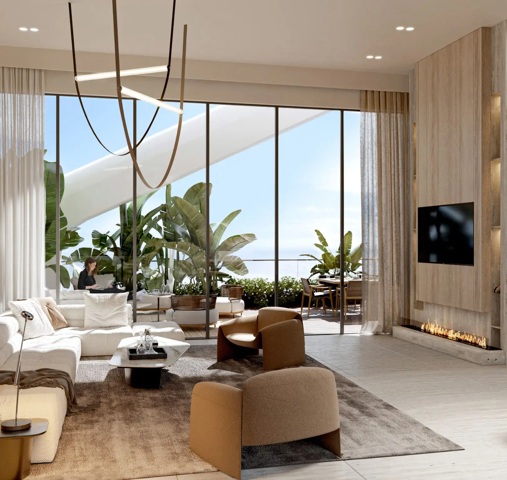 Spacious living room with large windows, plants, a sofa, and a wall-mounted TV.