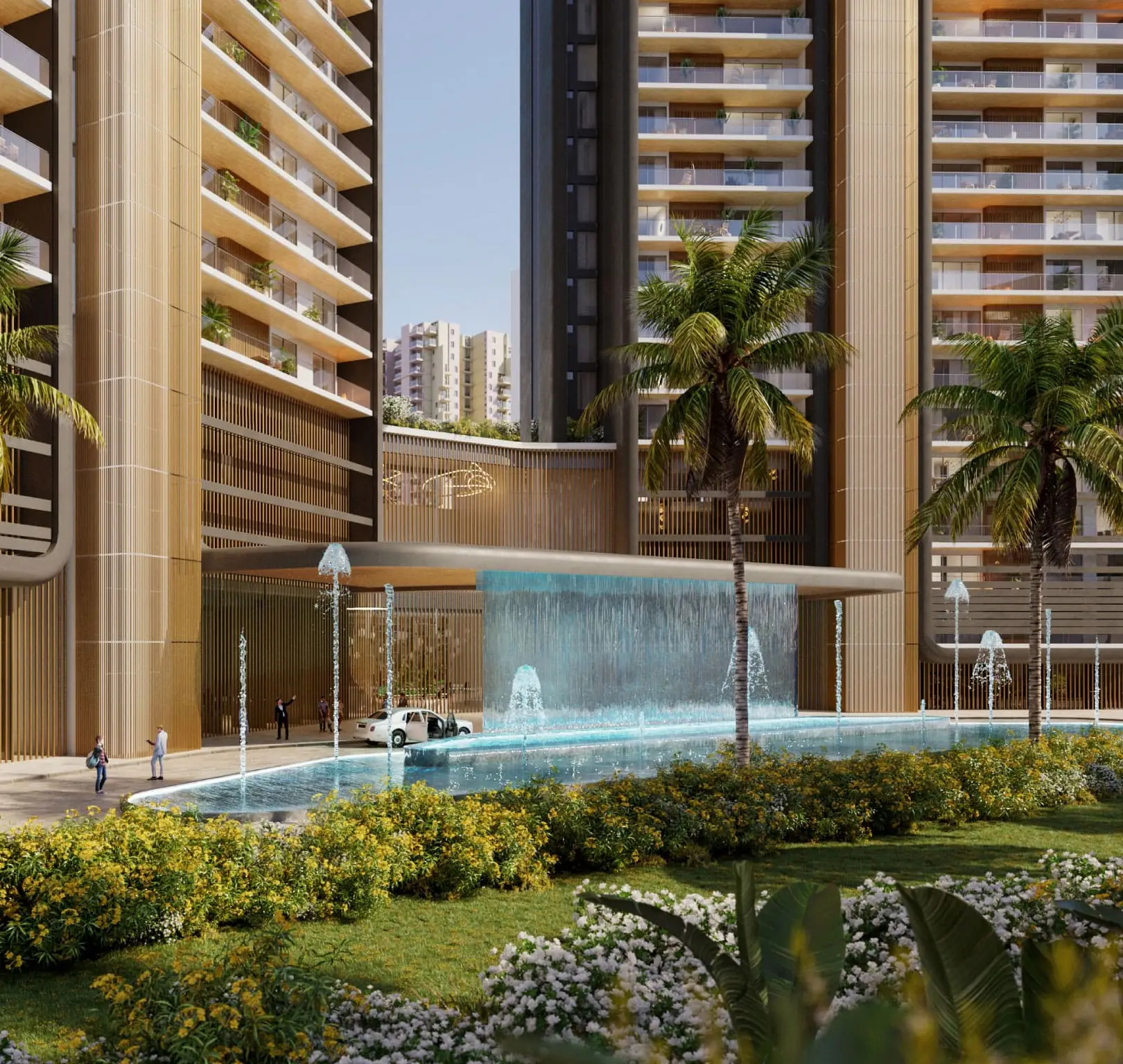 Contemporary building entrance with water features, palm trees, and landscaped garden.