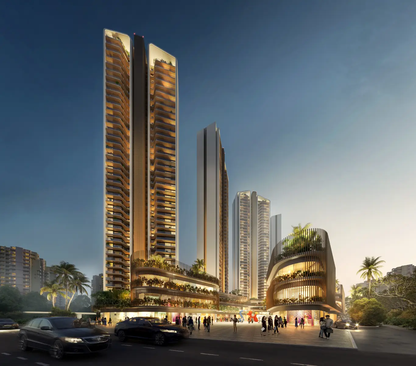 Three tall residential buildings with illuminated facades and a landscaped plaza at dusk.