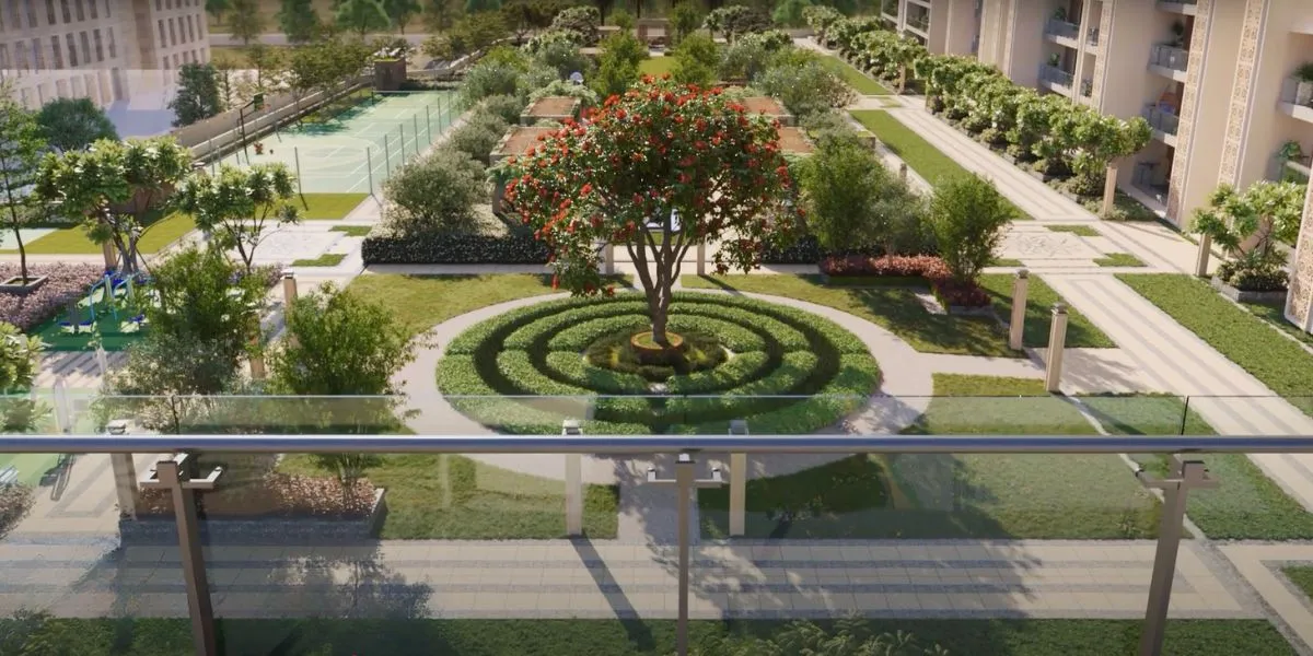 A landscaped community garden featuring a circular tree design, pathways, and tennis courts.