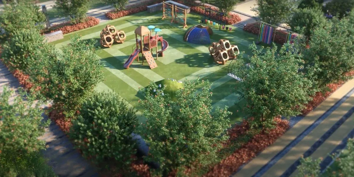A vibrant playground featuring slides, climbing structures, and colorful play equipment surrounded by greenery.