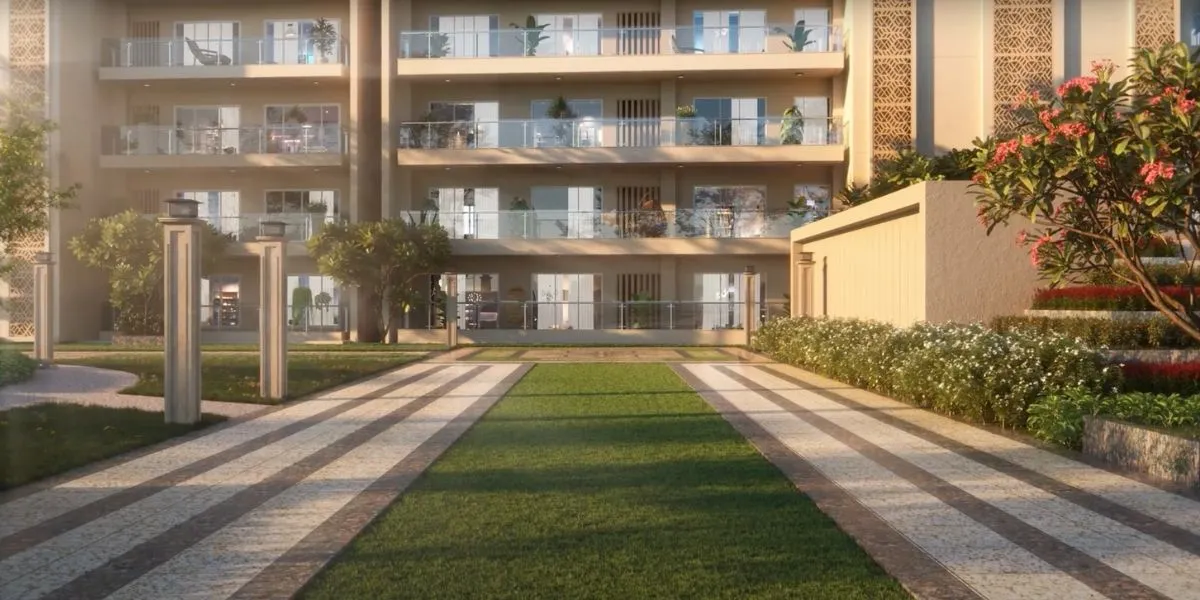 Multiple walkways leading to a modern building with balconies and landscaped gardens.