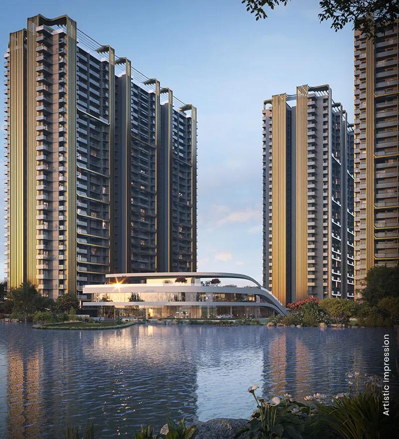 Two tall residential buildings beside a serene lake with modern architecture and greenery.