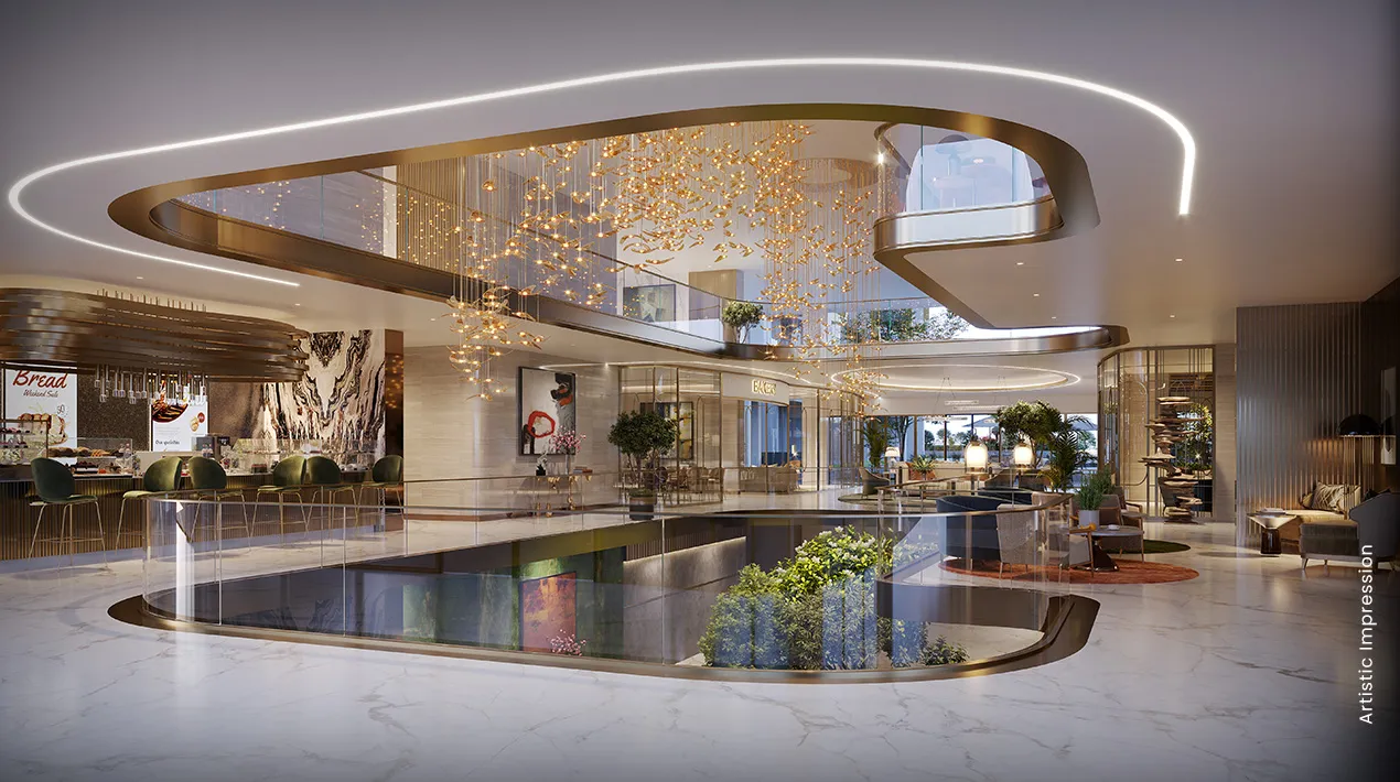 Spacious lobby with elegant design, glass railings, decorative lights, and greenery.