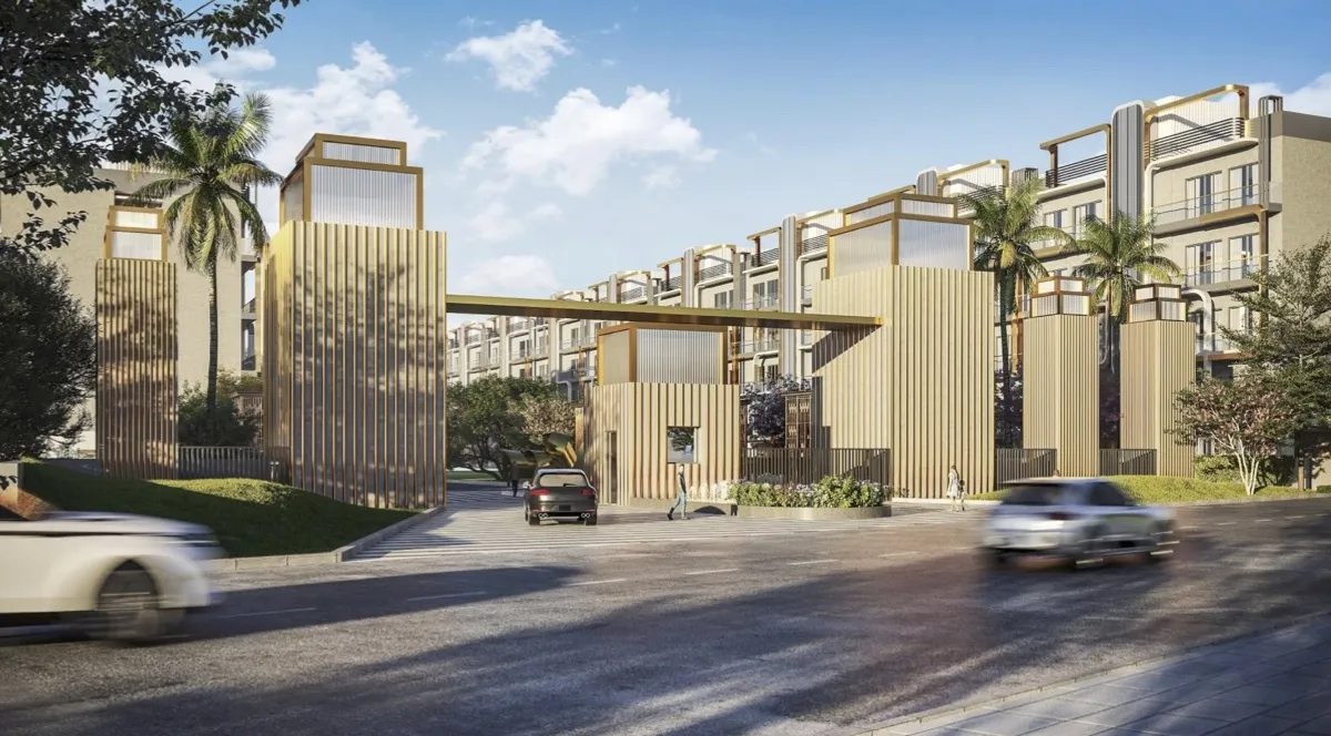Contemporary entrance with wooden structures, palm trees, and vehicles on a road.