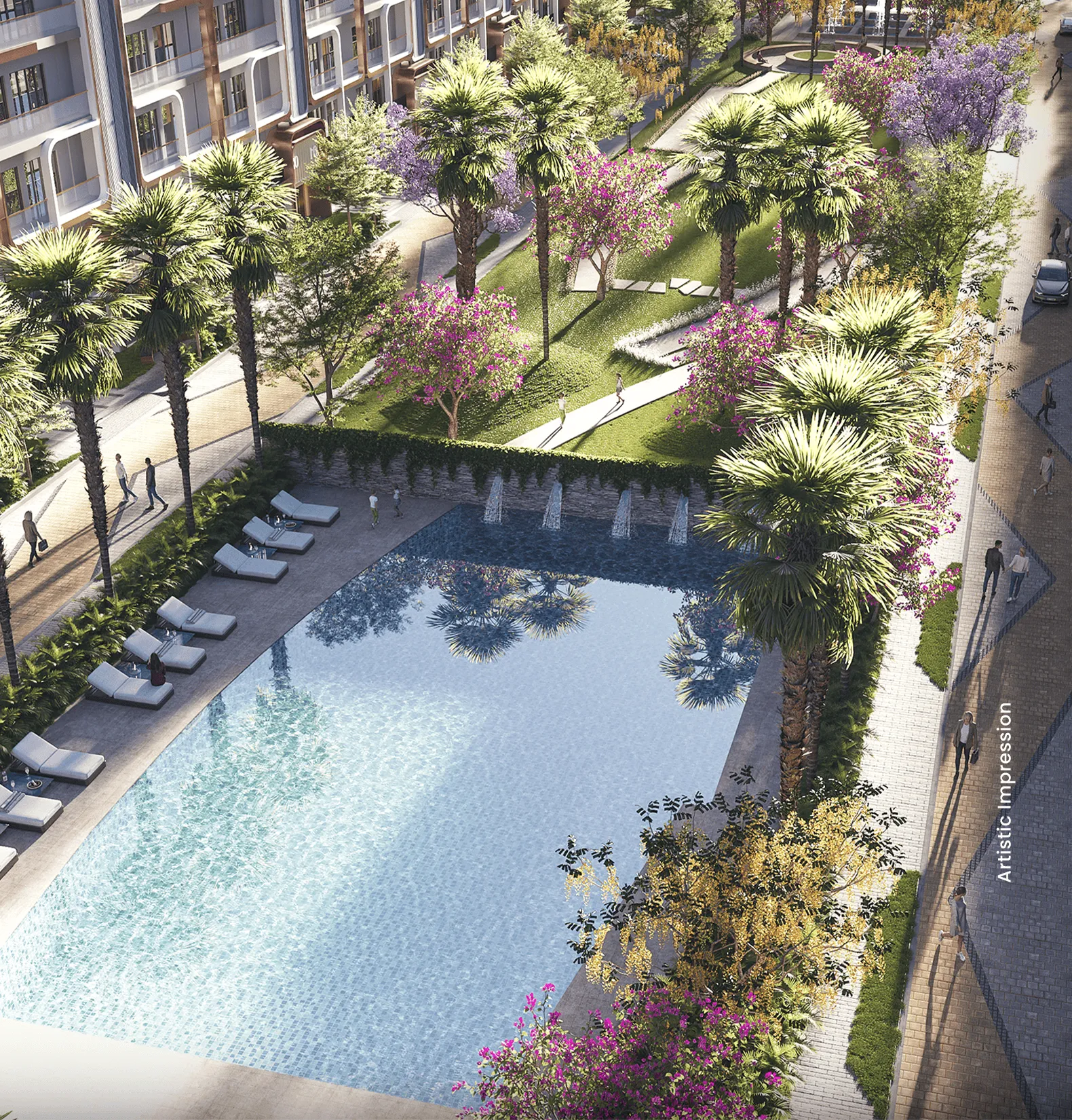 Aerial view of a swimming pool surrounded by palm trees and flowering plants.