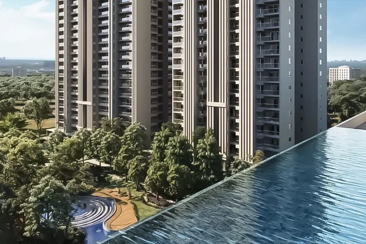 View of an infinity pool with tall residential buildings and lush greenery in the background.