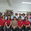 Seven newly certified Laughter Yoga Leaders celebrating their graduation from the training course
