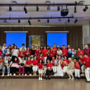Group photo of volunteers and residents at Ren Ci Community Hospital National Day celebration