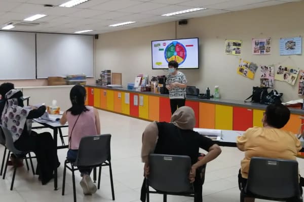 Participants engaged in Project Taking Charge 2022 training session