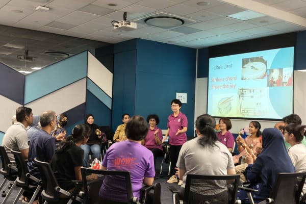 Caregivers participating in Laughter Yoga session at Nee Soon Central CC