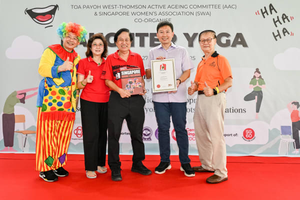 Minister Chee Hong Tat with SWA representatives and Singapore Book of Records official celebrating the Largest Mass Laughter Yoga Session