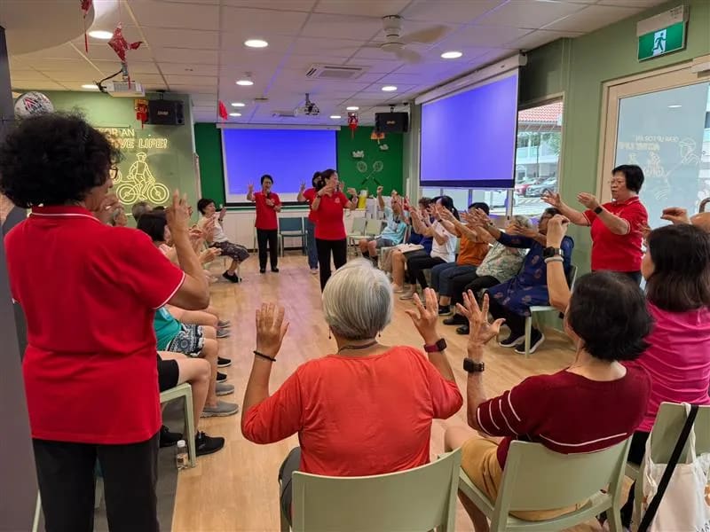Seniors participating in laughter yoga exercises