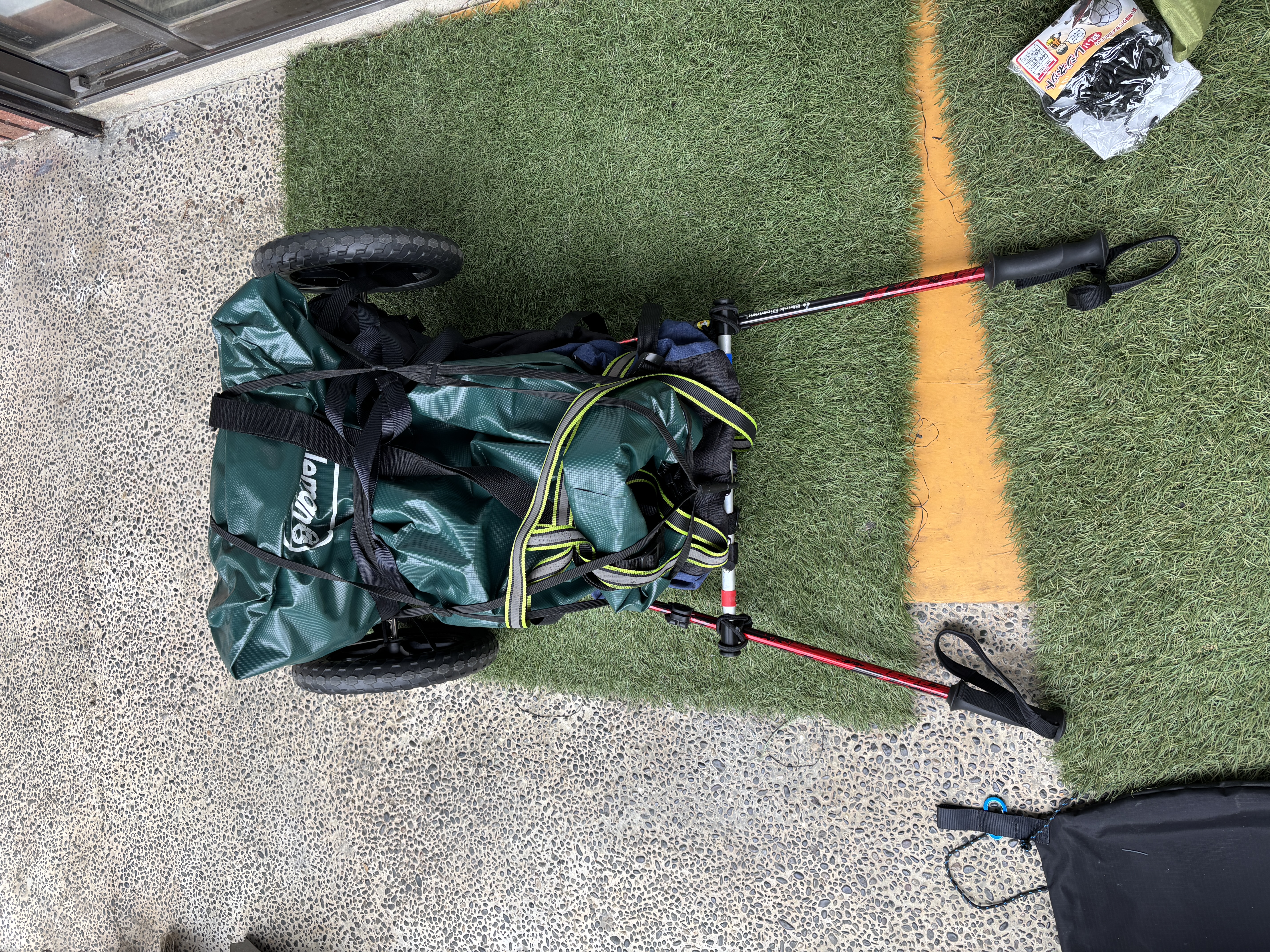 A bicycle with a trailer attached, assembled and ready for the big trip.