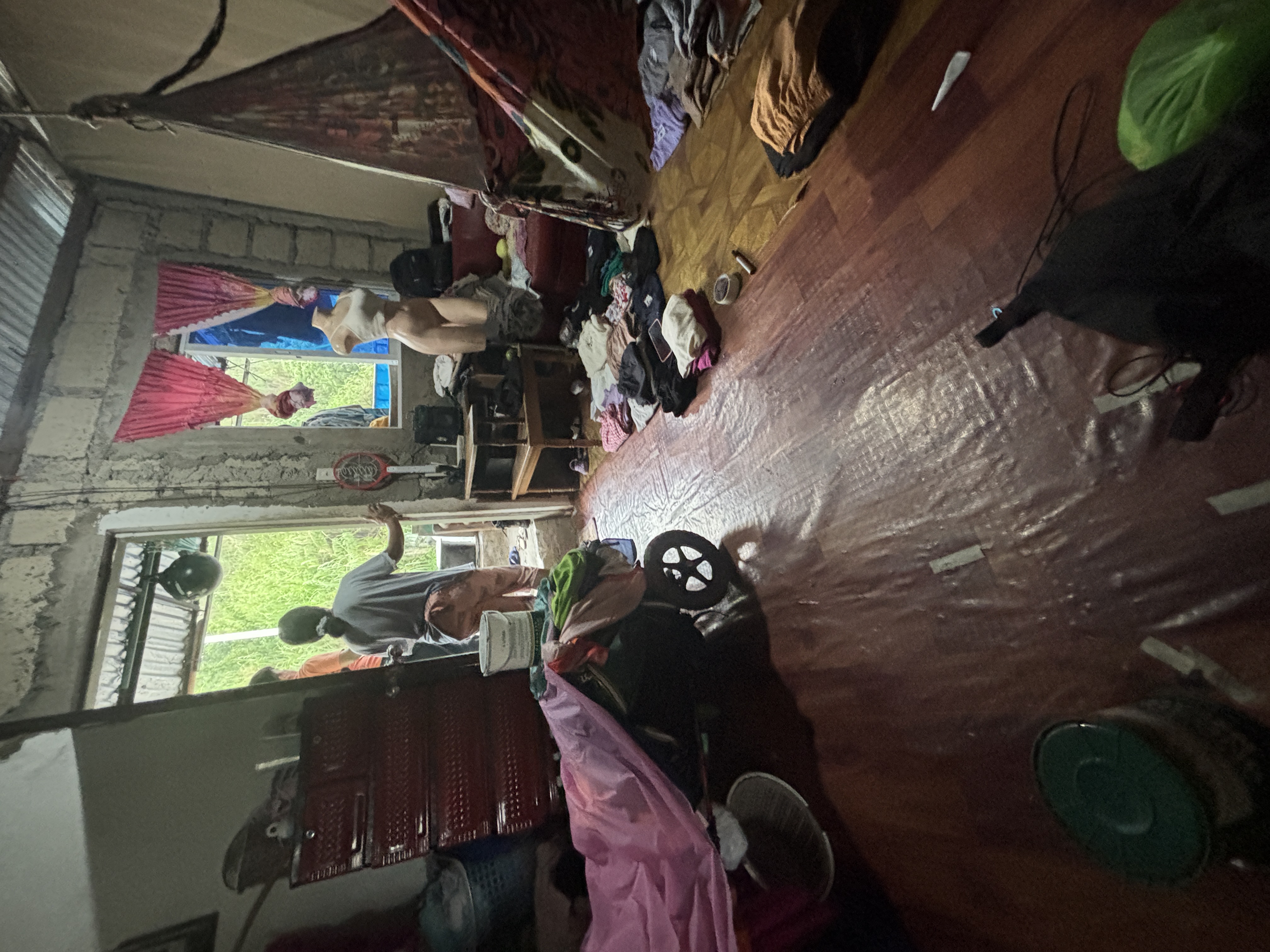 A local family who let me shelter in their home when the rain started