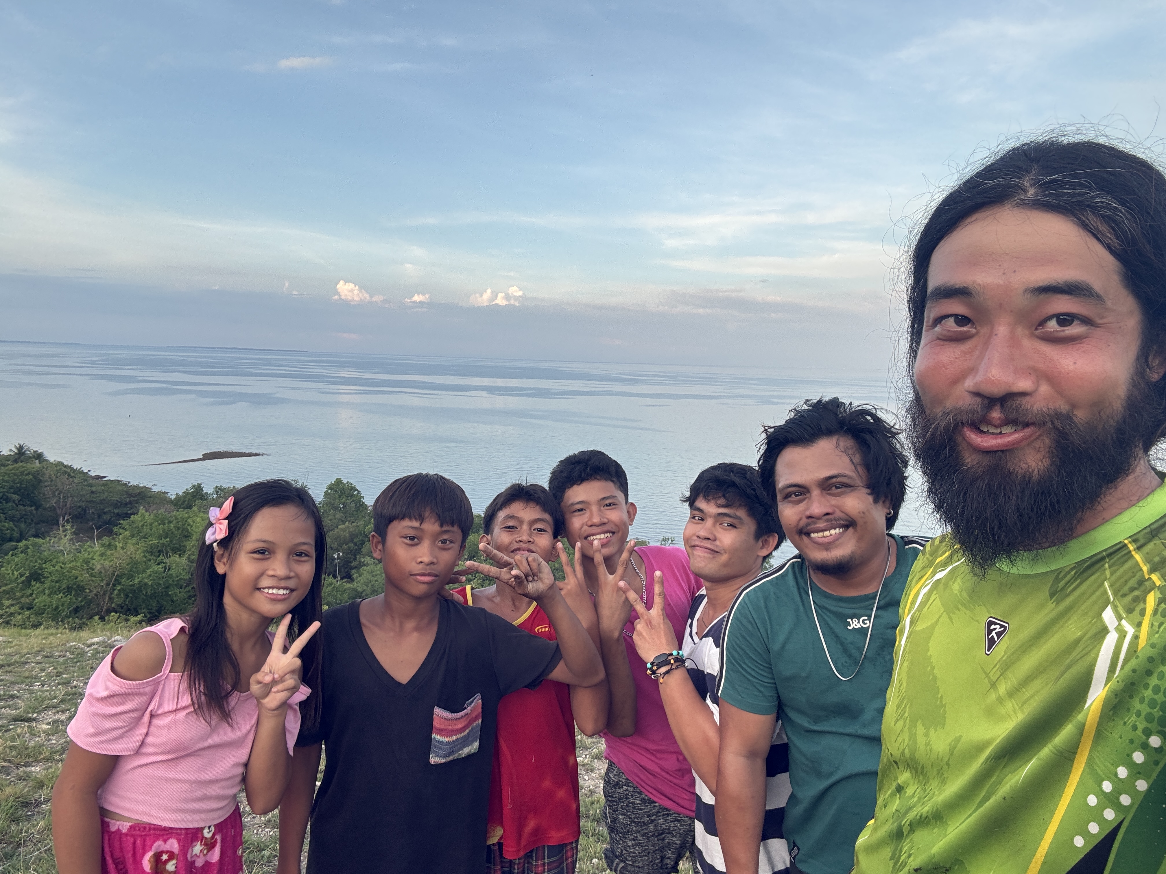 Sharing a moment with other villagers up on the hill in Malapay