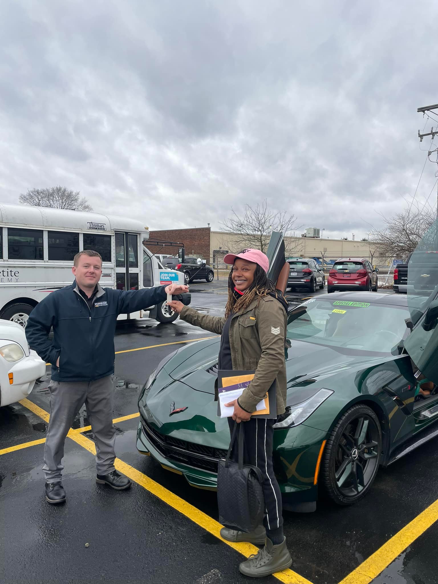 Scott Hall delivering a vehicle to a happy customer