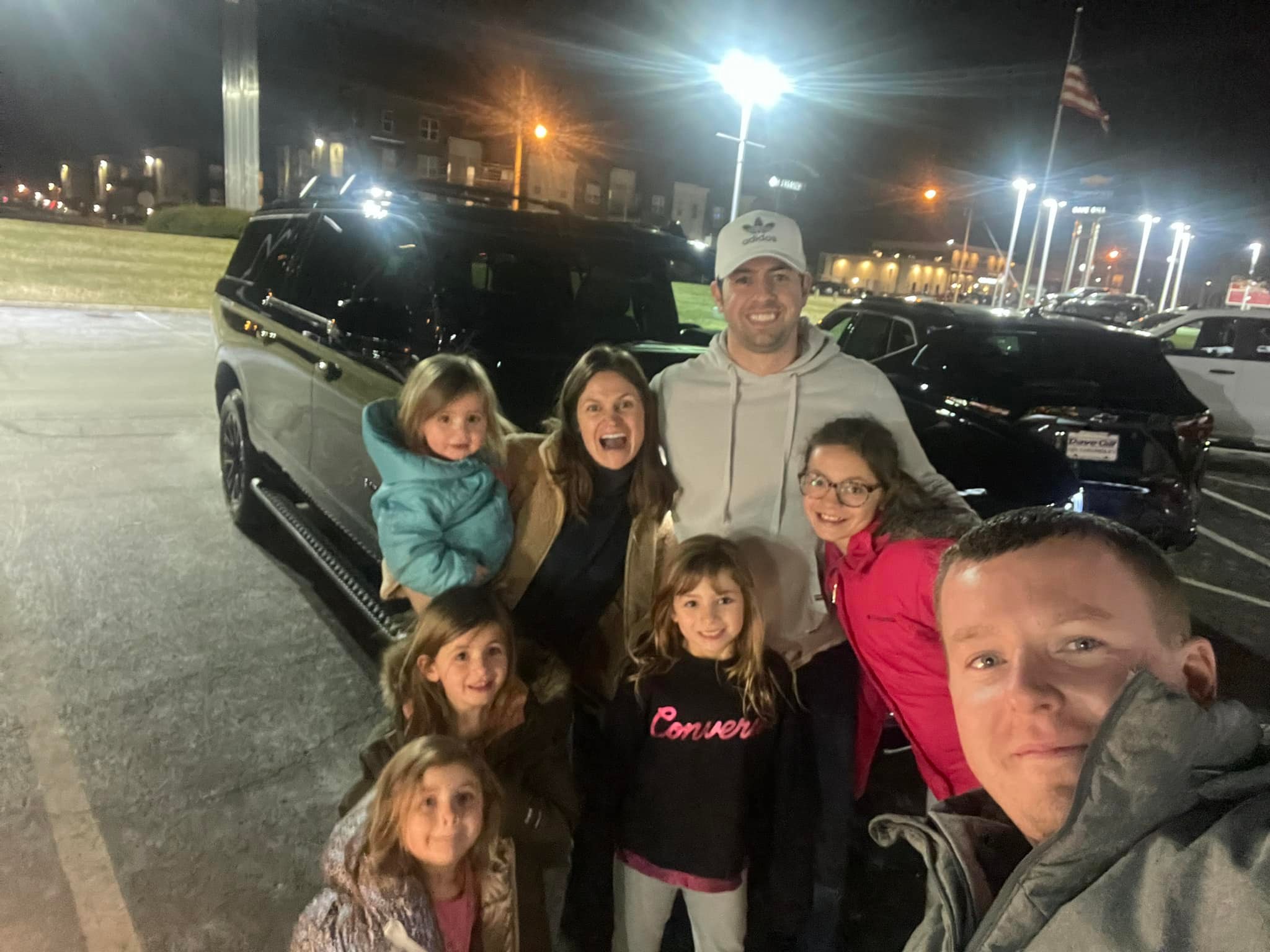 A whole crew alongside their new ride