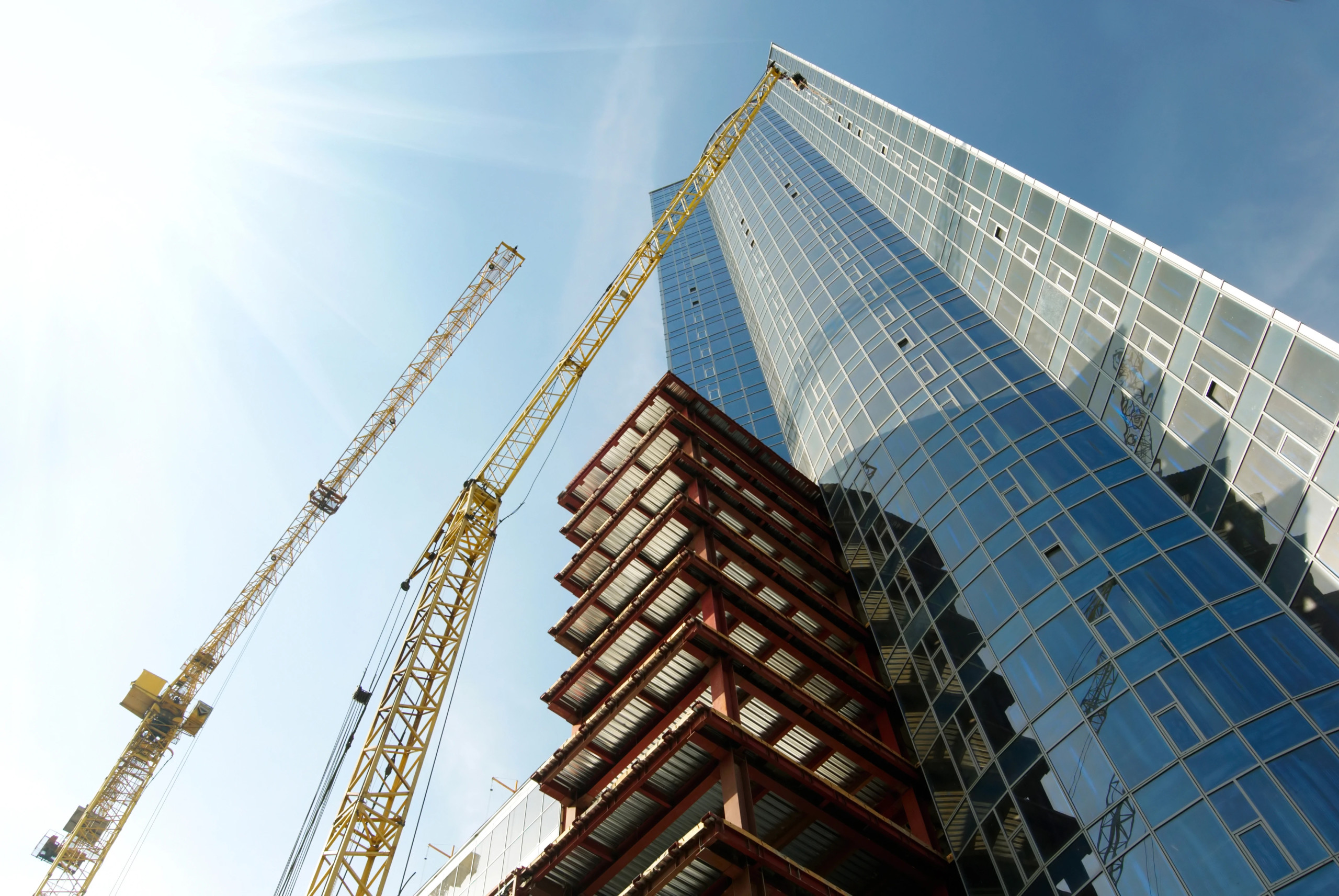 Contractor and CPA reviewing construction project budgets and timelines