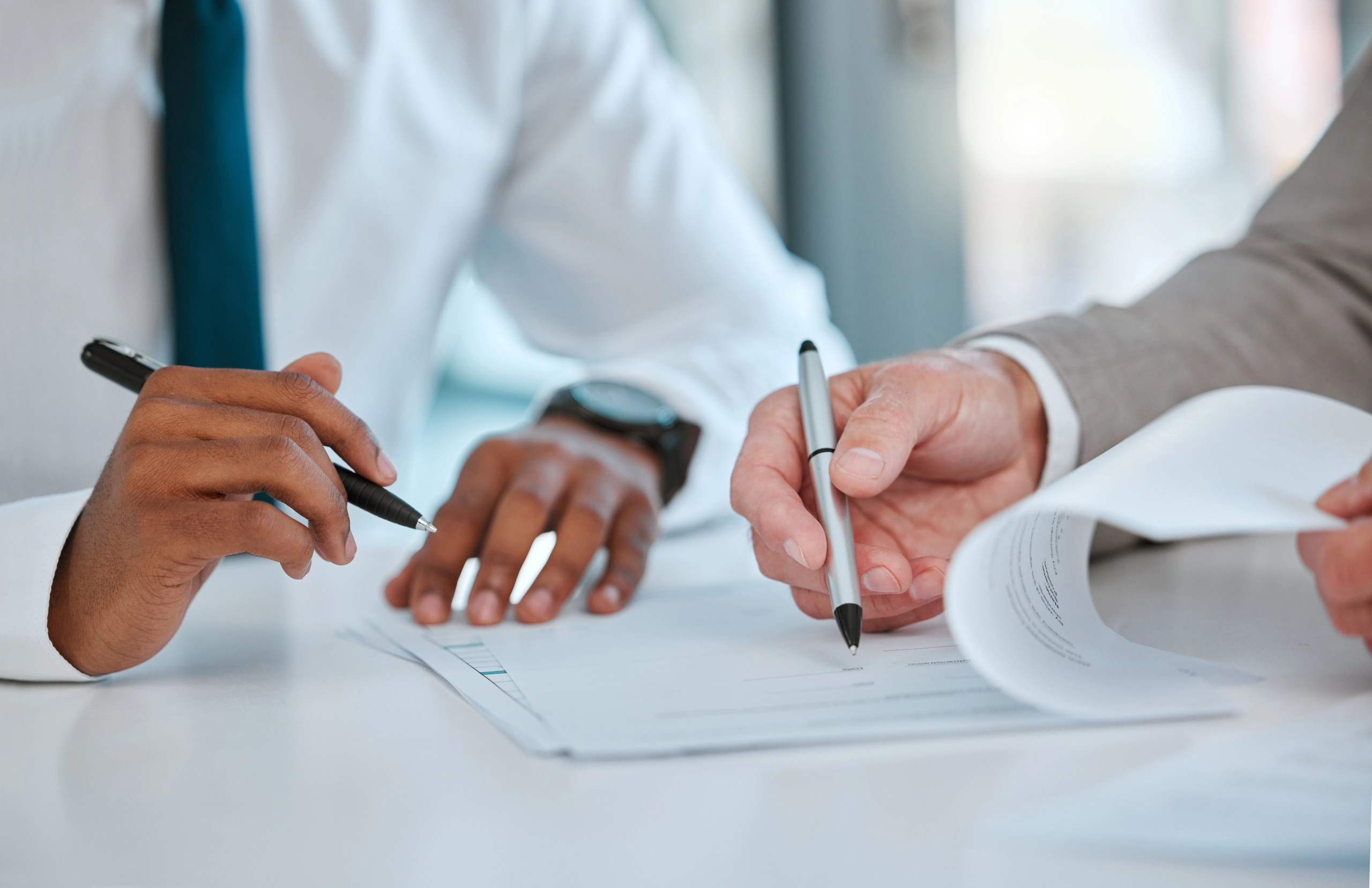 Advisor drafting financial policies and procedures with a client