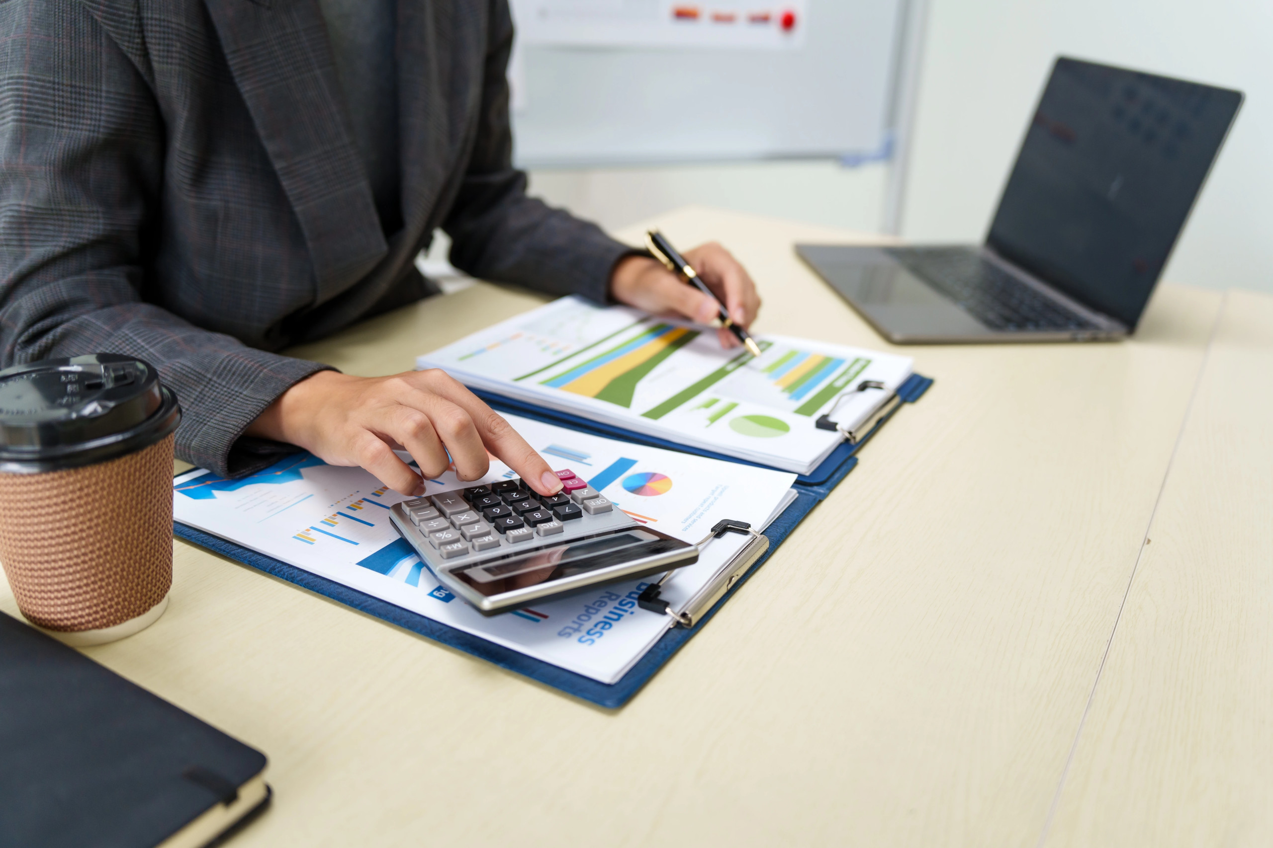 Tax advisor reviewing entity structure, timing, and deduction strategies with a client