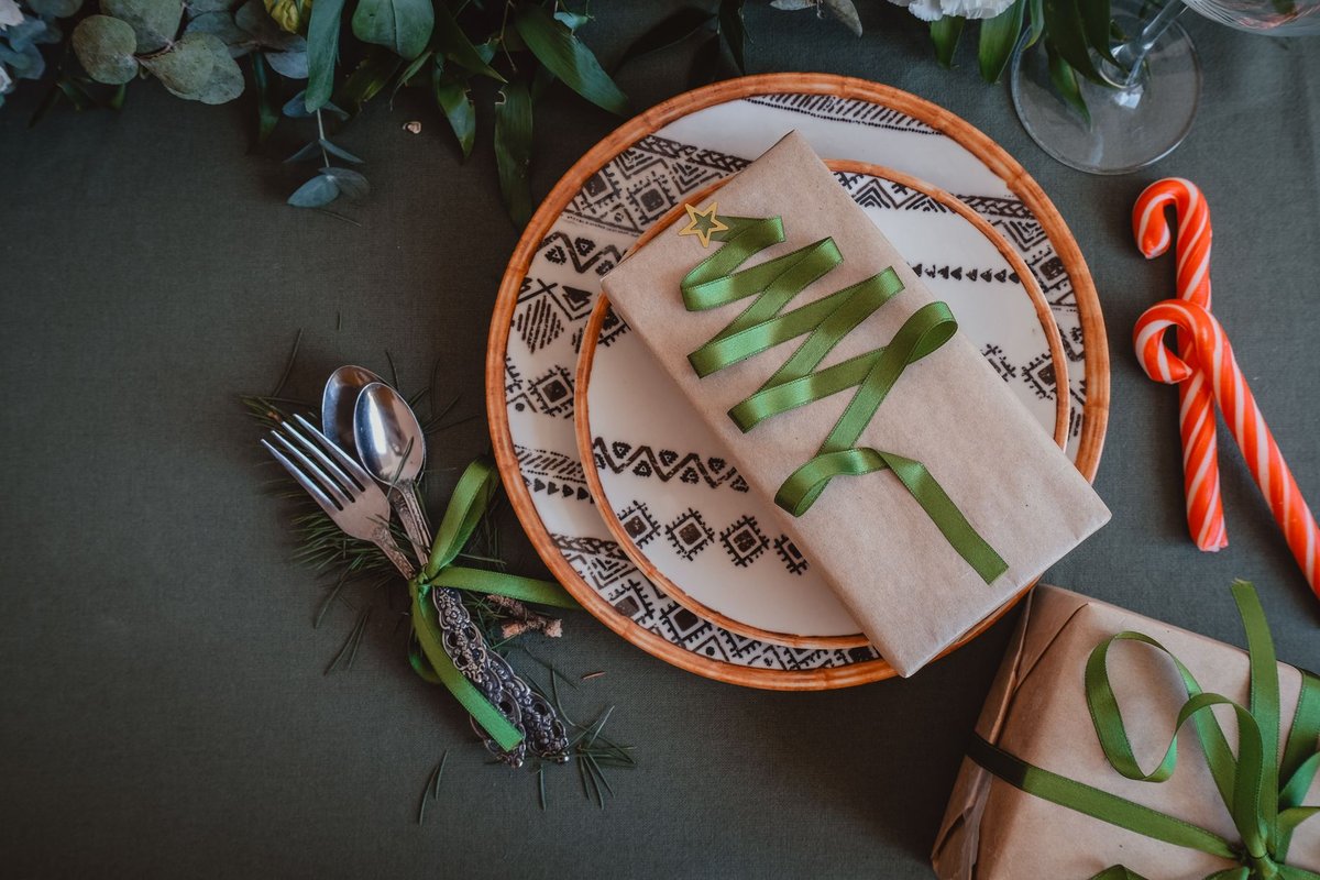 Elegant Christmas table setting with wrapped gifts and candy canes, ideal for holiday inspirations.