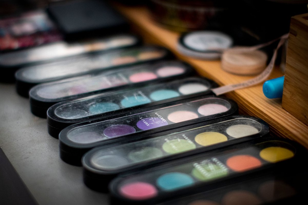 Vibrant and colorful makeup palettes neatly arranged, showcasing diverse shades.