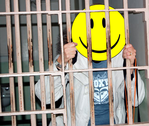 Happy Tourist Inside Alcatraz Prison Cell