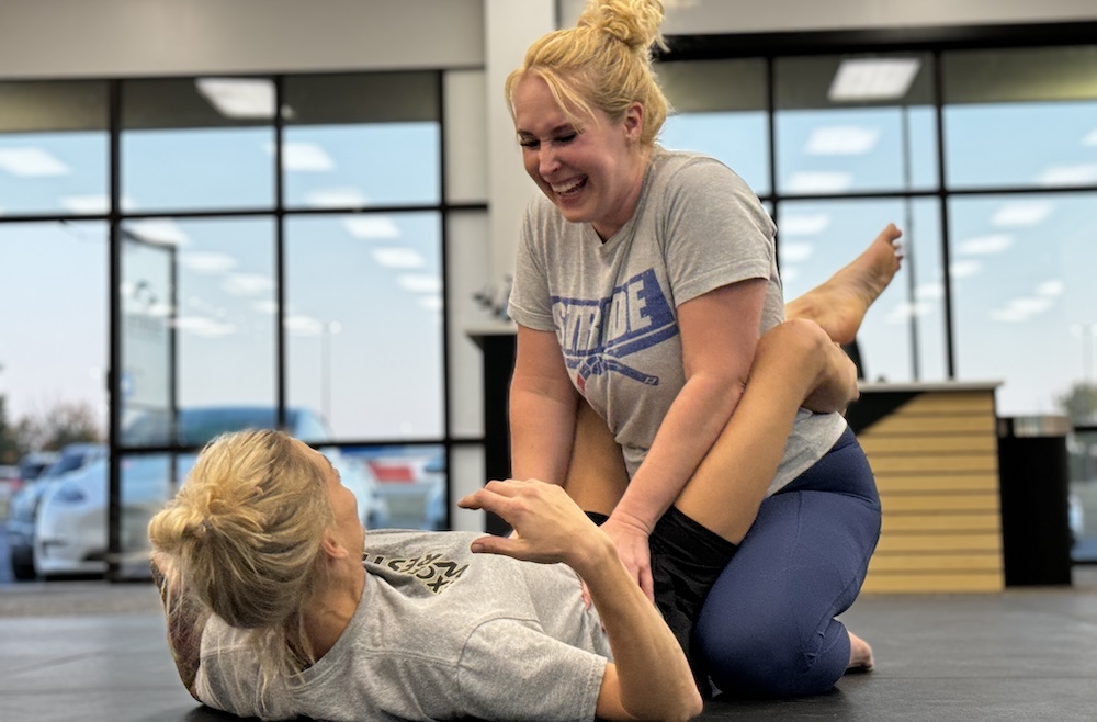 two women practicing bjj
