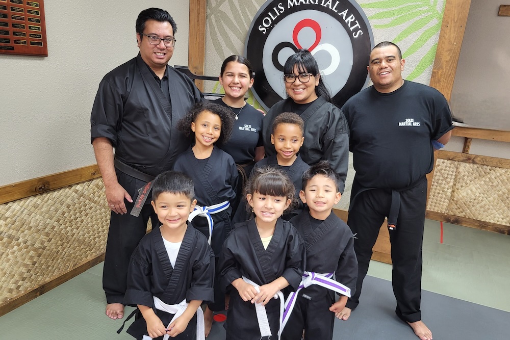 two kids holding karate poses