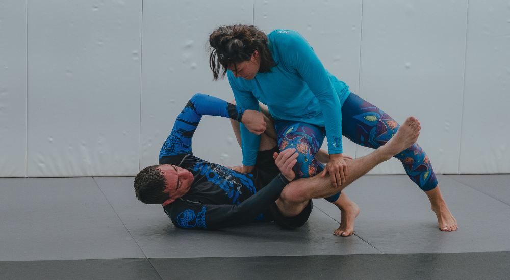 two people grappling in a jiu jitsu class in the Bronx