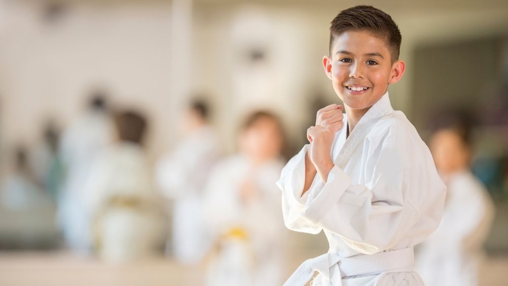 young boy in a karate uniform at a martial arts class in the Bronx
