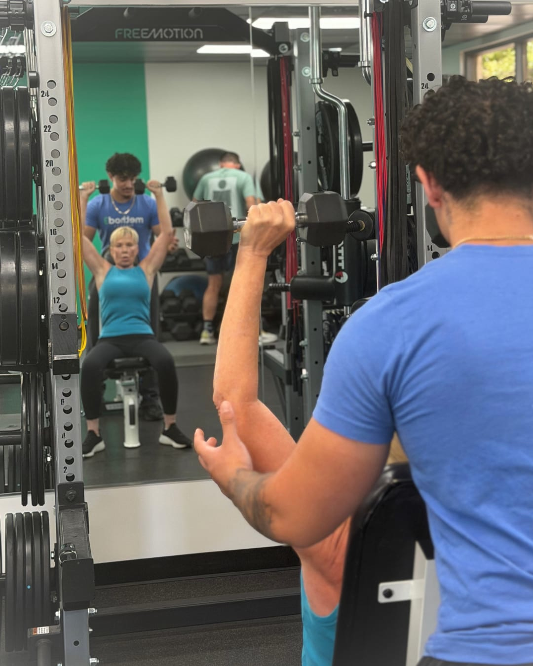Method3 Fitness coach monitoring a partner's movement and exercise technique