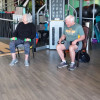 Adaptive Group Fitness Programs near Surprise