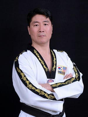 Instructor Grand Master Young Kim with Master Kim's World Taekwondo.