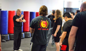 Holding Focus Mitts for Kickboxing 101
