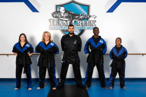 4 new Black Belt Graduates and 1 2nd degree Black Belt Graduate