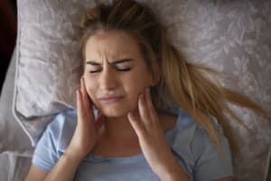 TMJ DISORDER: CAUSES AND SIGNS YOU MIGHT NEED A NIGHT GUARD