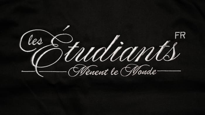 Back Embroidery 'Les Étudiants Mènent le Monde' - Main View showing French text