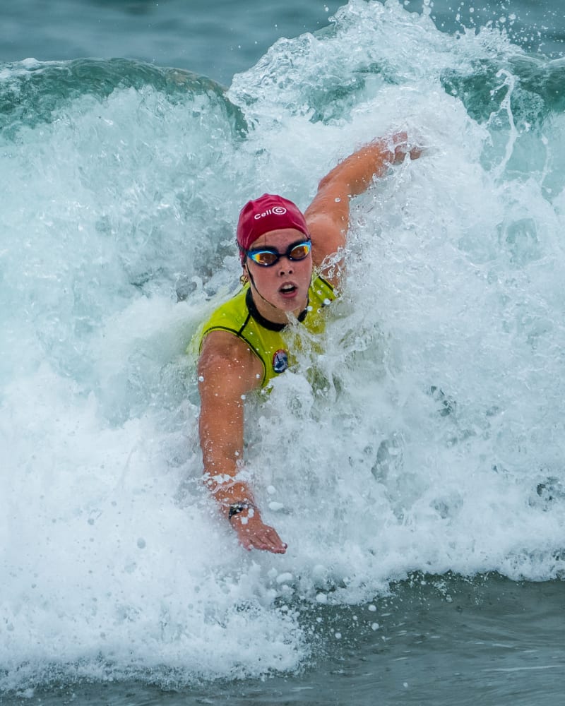 Surf lifesaving competitor powering through break Durban KwaZulu-Natal — Kevin Rom PROFarazzi Media
