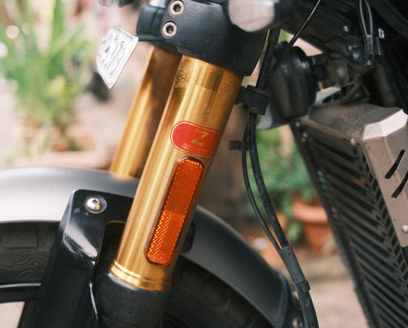 The gold Zedling front fork, with the Zedling badge on the lower tube