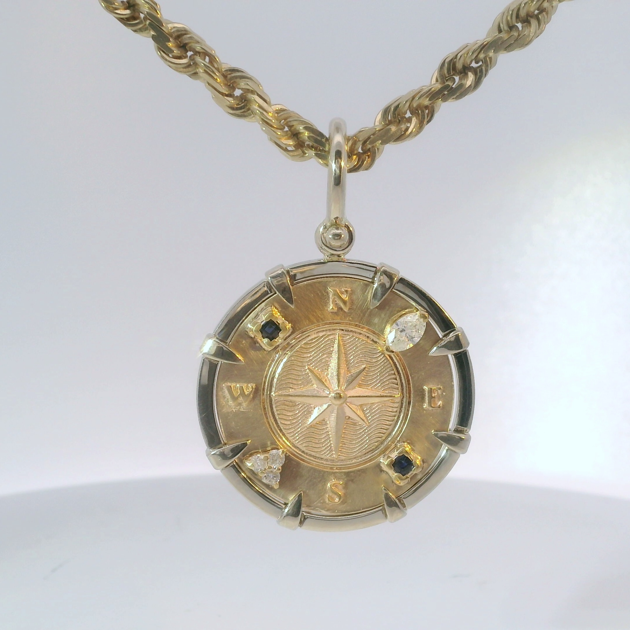 Custom compass pendant with gemstone details by Jesse the Jeweler