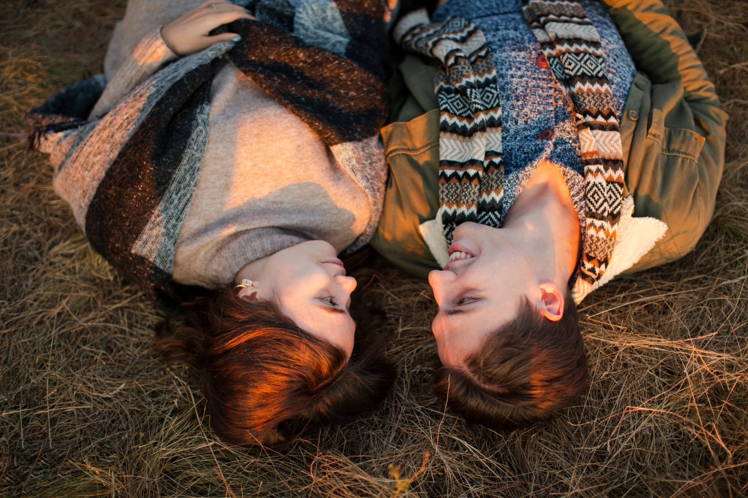 A couple lying in the grass