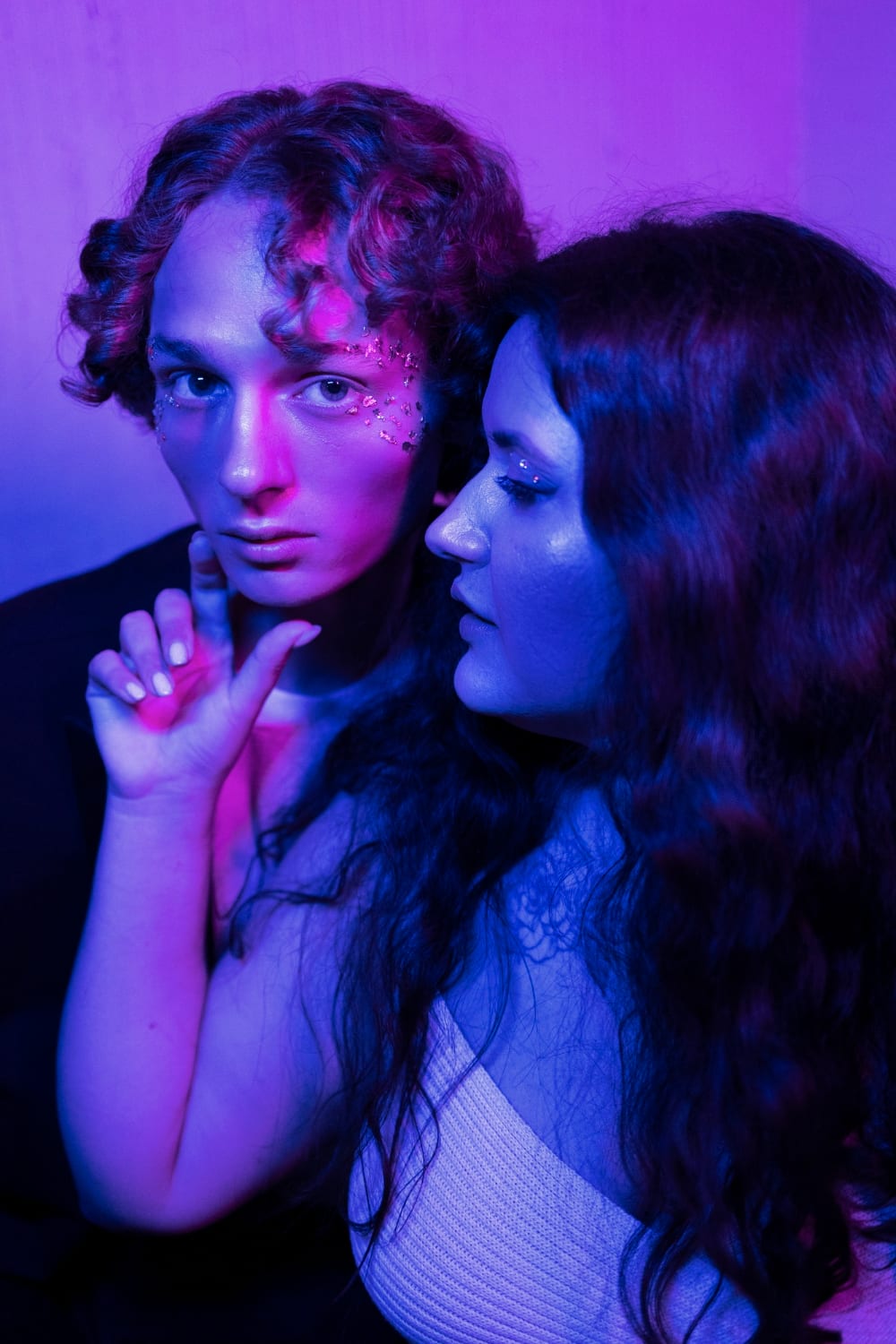 Couple posing, purple dreamy background