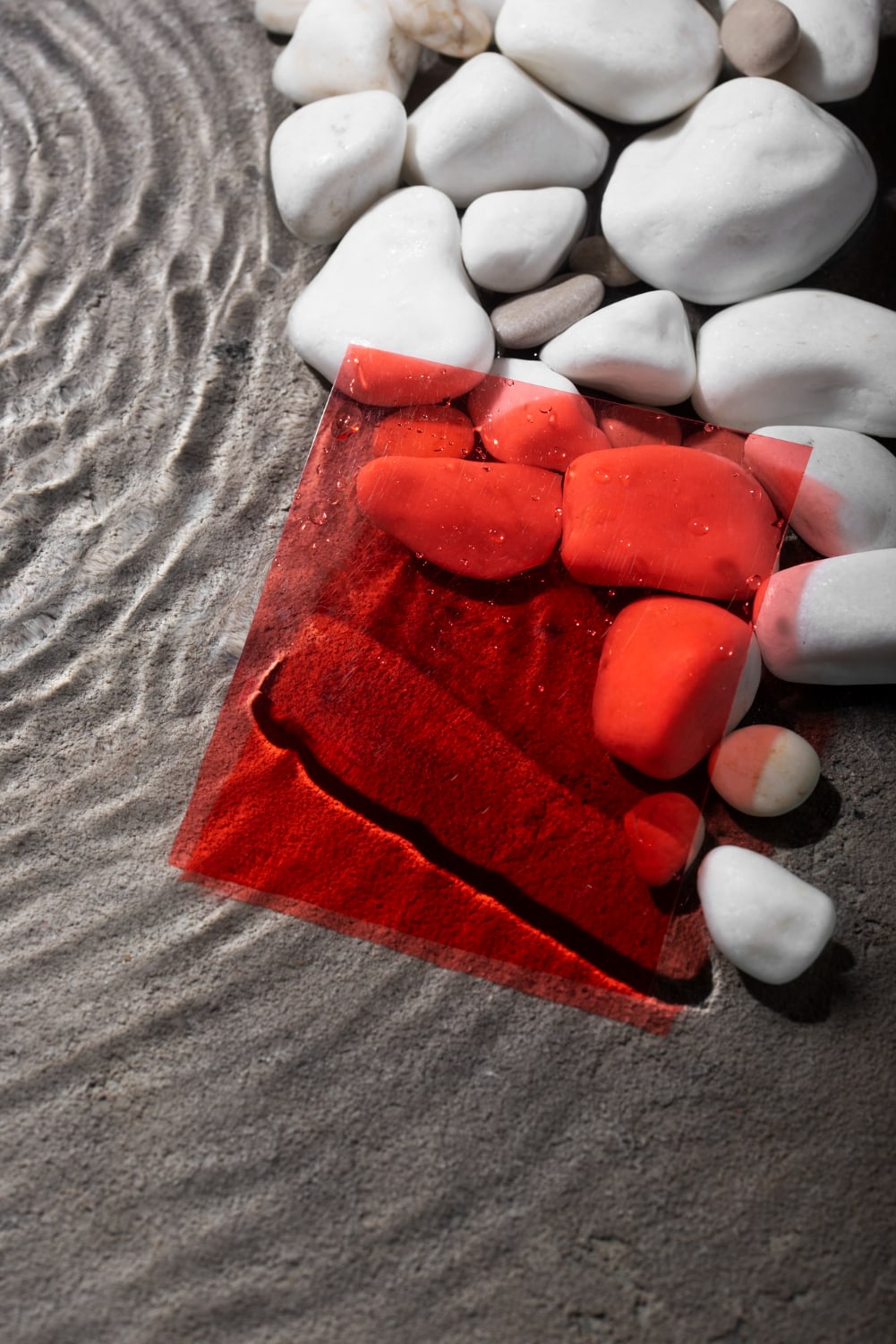 Black and white photo of a beach, with red square filter.