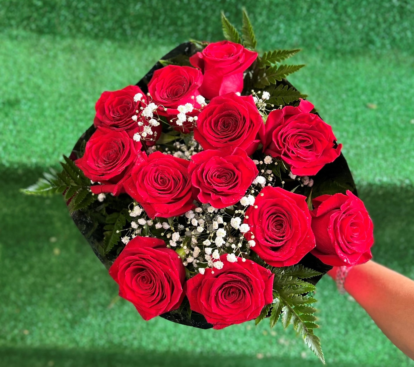 12 red roses in a bouquet